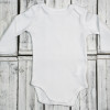 Teddy bear and personalised bodysuit with baby’s name